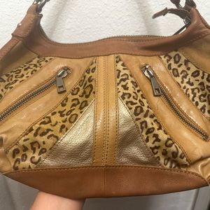 Fossil leather cheetah print vintage shoulder bag.